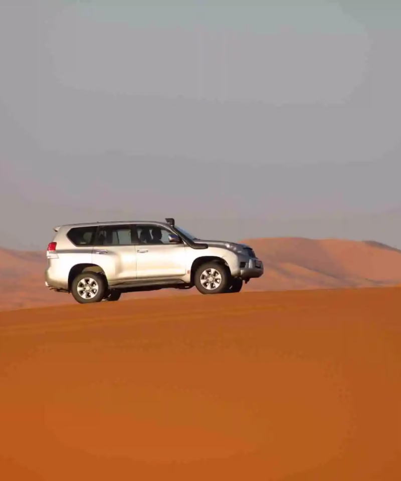 Silver Prado on the top of Merzouga Desert dunes during our 3 Morocco tour from Fes - Fes Desert tour - Morocco travel package - Morocco tour package - Morocco trip package - Morocco holiday packages / Moroccan travel tours