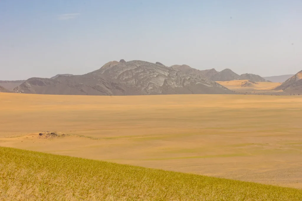 Desert plain and mountains on the road to Erg Chigaga