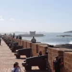People walking in the Skala of Essaouira during our 12 day Morocco tour from Casablanca - Morocco travel package - Morocco holiday - Morocco vacation package - Morocco tour package