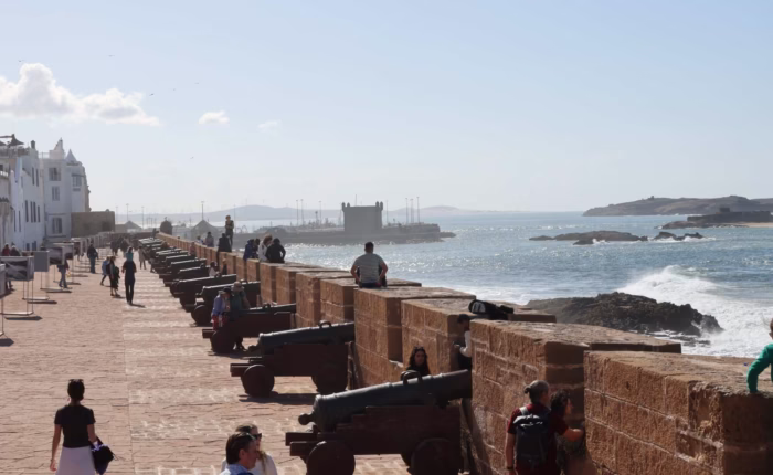 People walking in the Skala of Essaouira during our 12 day Morocco tour from Casablanca - Morocco travel package - Morocco holiday - Morocco vacation package - Morocco tour package