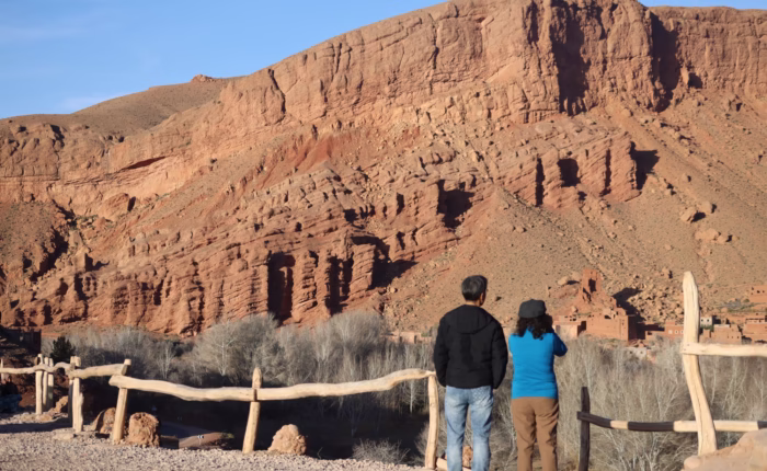 A couple enjoying the panoramic view of the monkey fingers in Dades valley - Morocco travel package - agadir holiday - Morocco excursion - Morocco tour package
