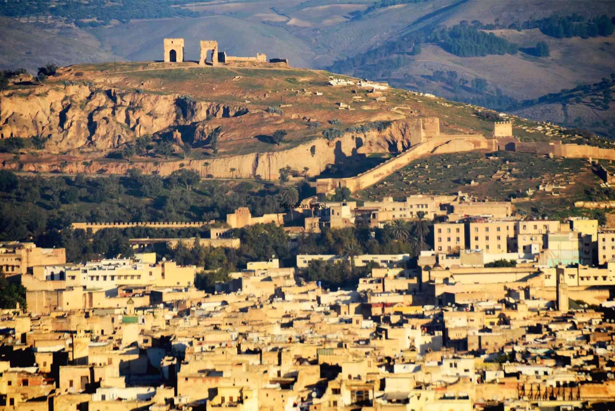 The panoramic view of the Medina of Fes from the Borj south during our 8 day Morocco tour from Fes - Morocco Roundtrip from Fes - Morocco travel package - Morocco holiday from Fes. - Morocco trip package from Fes - Morocco tour 8 days